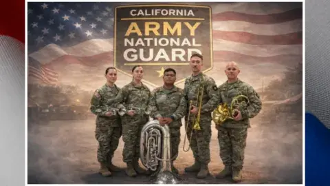 Brass quintet of the Army National Guard is standing in front of an America Flag