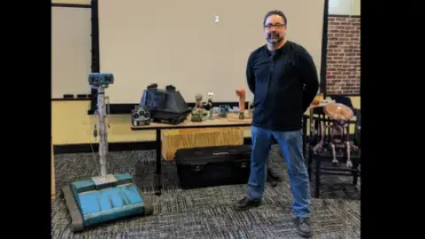 Man surrounded by robots