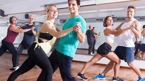 Three couples dancing in a studio