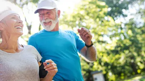 senior man and woman walking