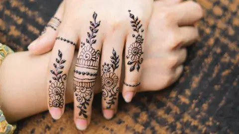 hands with henna design