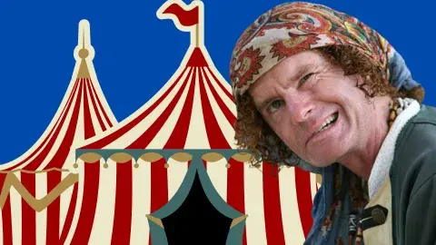 Christopher Yates in front of a white and red stripped circus tent