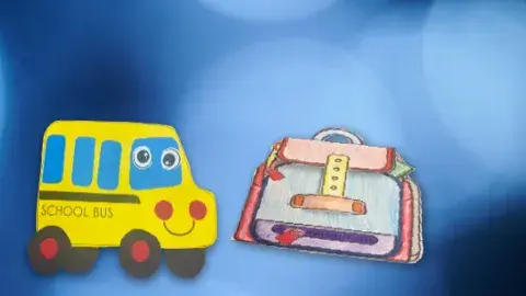 A paper school bus and backpack