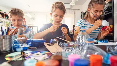 Young people craft with recycled materials