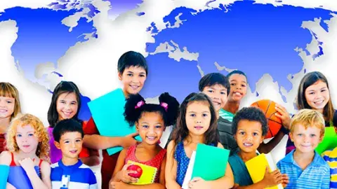 Kids holding books with a worldmap as a background