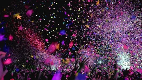 A color photo of multicolored confetti being thrown in the air, Image by ktphotography from Pixabay