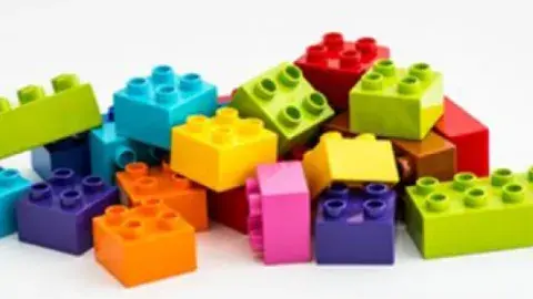 pile of different colored LEGO bricks