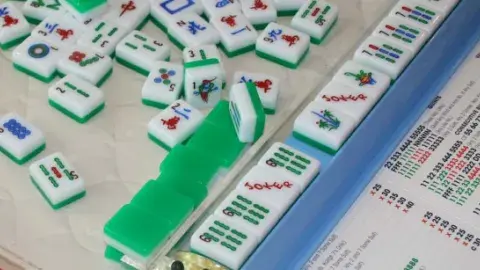 Image of Mah Jongg tiles in play
