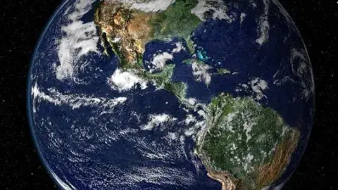 Earth and the moon against a the blackness of space 