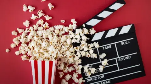 A bucket of popcorn and a film marker