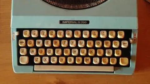 typewriter sits on a desk