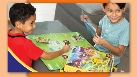 Two children playing Pokemon