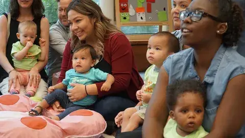 babys and caregivers in a storytime
