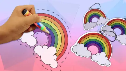 Hand coloring a rainbow onto plastic sheets which will become shrinky dinks once baked