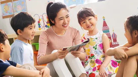 young woman volunteer with four students