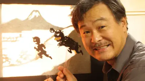 Mr. Seki showing his shadow puppets.