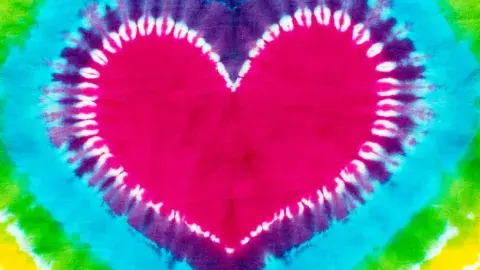 A multicolored tie-dye design in the shape of a heart.
