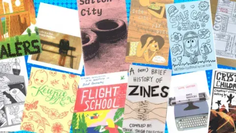 Different colored and sized zines facing up.