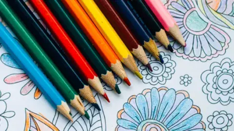 Colored pencils on a coloring sheet