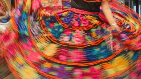 Dancer twirling in a folklorico dress
