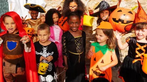 A group of children in Halloween costumes