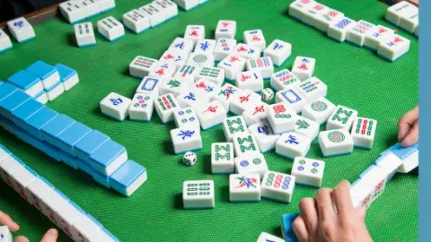 mahjong tiles on felt mat