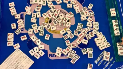 Mah Jong tiles being played mid-game.