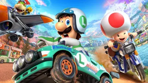 Luigi, Toad, and Baby Bowser racing in the Mario Kart game. 
