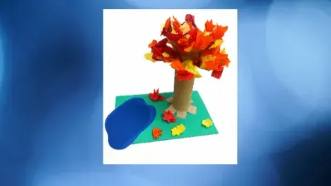 A TP roll tree craft with tissue paper leaves 