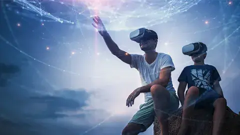A man and a boy wear virtual reality headsets against a space background
