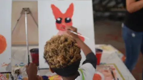 YOUNG PERSON PAINTING