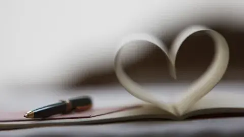 pen and paper folder in heart shape
