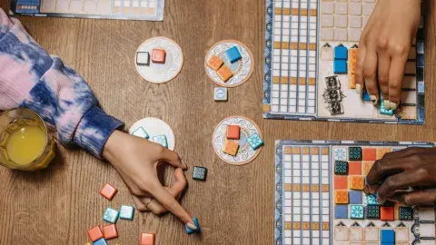 People playing a board game