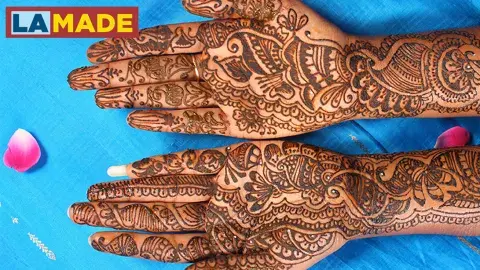 hands decorated in henna