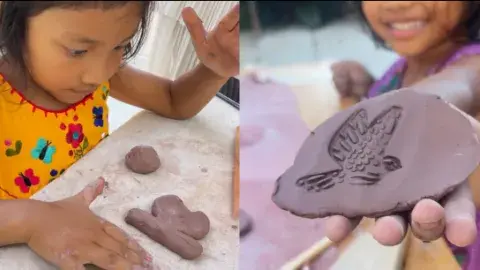 Child plays with clay