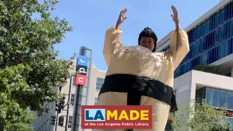 woman in a blow-up sumo costume