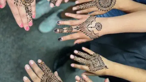 hands with henna designs