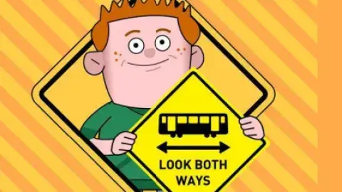 Cartoon boy holding safety sign. "Safety Begins with you!" message.