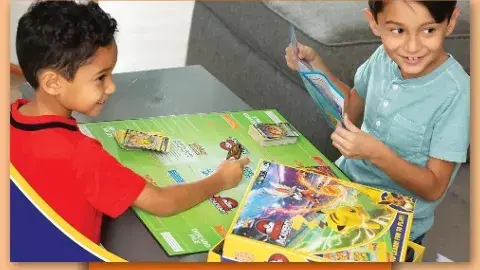 Children playing Pokemon Battle Academy