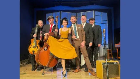 6 members of the Pepper Moons Swing Ensemble pose with their instruments