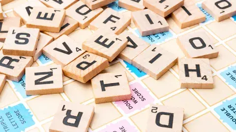 Close up of lettered wooden squares.