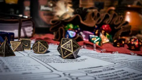 A handful of die cast over a gameboard. 