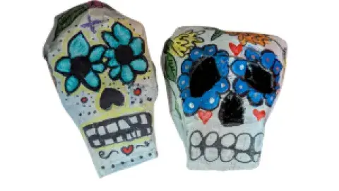 two paper mache skulls
