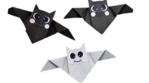 Three paper bats with happy faces