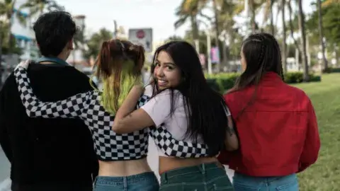 Four Teens walking 