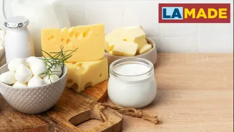soft cheeses displayed on a wood table
