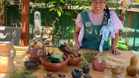 Assortment of clay items spread on a wooden table. 