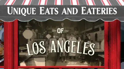 Restaurant front with striped awning pictured on part of the front book cover