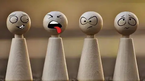 A group of game pieces with faces.