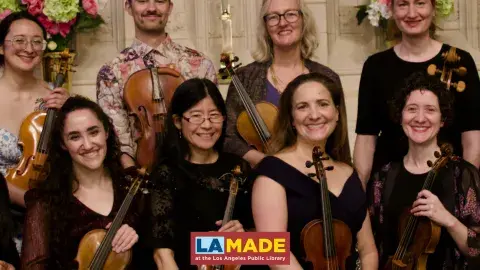classical musicians holding their instruments